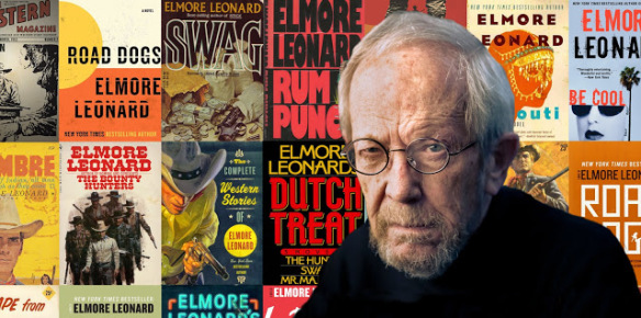 Elmore Leonard in front of some of his novels, including Rum Punch, which was adapted by Quentin Tarantino in the movie, "Jackie Brown".